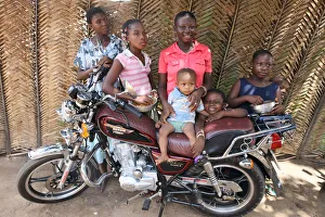 Motorcycle Prints: Family around a motocycle, Lome, Togo, West Africa, Africa