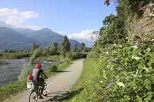 Family riding bicycle in Colico, Lake Como, Italian Lakes, Lombardy, Italy, Europe