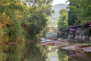 Stillness Prints: Famous ancient arch stone bridge in Shangli Town at sunrise with reflections in the water