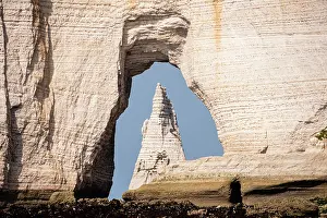 Stack Prints: Famous cliffs in Etretat show a natural arch framing a tall sea stack in Normandy