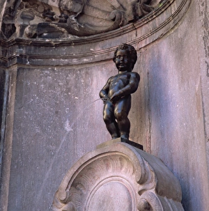 Nude Prints: The famous Manneken Pis statue in Brussels, Belgium, Europe