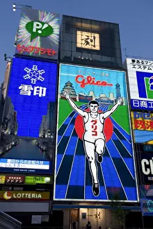 Advertisements Prints: Famous neon wall with Glico runner advert in Dotonbori district of Namba