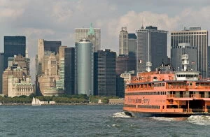 Images Dated 24th August 2009: The famous orange Staten Island Ferry approaches lower Manhattan, New York