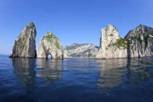 Images Dated 26th April 2010: Faraglioni Rocks taken from the sea in early morning summer sunshine, Isle of Capri