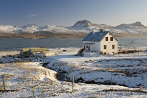 Farm in Borgarfjordur Eystri fjord, Mount Burfell, 464m, on east shore of Borgarfjordur in the distance, East Fjords, Iceland