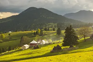 Transylvania Prints: Farm and haystacks in the rural Transylvania landscape at sunset, Piatra Fantanele