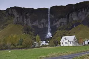 Farm and waterfall (Foss a Sidu), at Dverghamrar, east of Kirkjubaejarklaustur