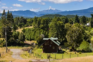 Farmhouse Prints: Farmhouse below the Volcano Villarrica and the beautiful landscape