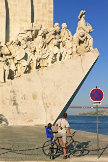 Belem Prints: Father and son on a bicycle in front of the Monument
