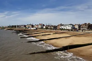 Crane Prints: Felixstowe Beach from the pier with Container Port cranes in the distance