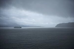 Images Dated 19th September 2010: A ferry boat moves through stormy weather from Vashon Island to West Seattle