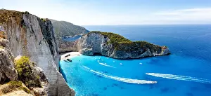 Shipwreck Prints: Ferry boats in the turquoise lagoon surrounding the iconic Shipwreck Beach (Navagio Beach)