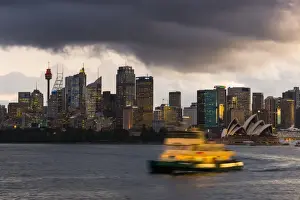 Sydney Prints: A ferry in Sydney Harbour at dusk with the Opera House and city skyline