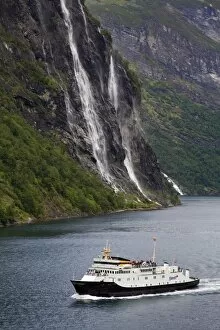 Ferry and waterfall, Geirangerfjord, Northern Fjord Region, Norway, Scandinavia, Europe