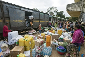 Crowded Prints: Fianarantsoa to Manakara FCE train, cargo being unloaded, eastern area, Madagascar