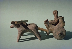 Figure in a chariot or cart drawn by animals