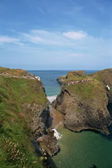 Ulster Prints: Figures crossing Carrick-A-Rede Bridge over cove