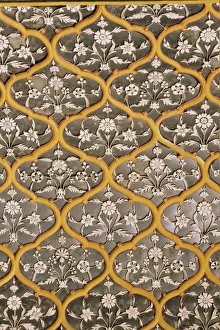 Detail of the fine mirror and plaster work found in the Sheesh Mahal