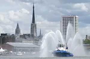 Fires boats on River Seine and Rouen cathedral behind, Rouen, Normandy, France, Europe