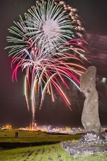 Fireworks ring in the New Year from the town of Hanga Roa over moai in the Tahai Archaeological Zone on Easter Island (Isla de Pascua) (Rapa Nui), UNESCO World Heritage Site, Chile, South America