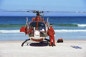 Rescue Prints: First aid medical helicopter lands on the beach