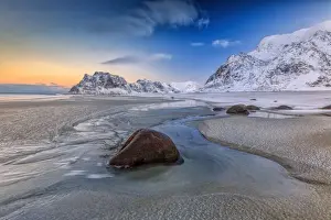 Boulders Prints: The first light of dawn illuminates the rocks shaped by the wind and the cold sea of Uttakleiv