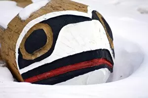 First nation carved bench in snow, Banff, Alberta Canada, North America