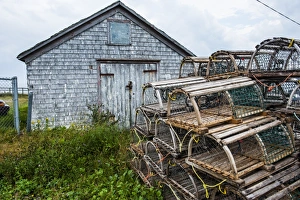 Stack Prints: Fish traps in front of a shingle hut in Neils Harbour