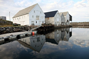 Traditionally Norwegian Prints: Fish warehouses, Runde, West Norway, Norway, Scandinavia, Europe