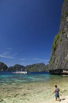 Bacuit Bay Prints: Fisherman on Coral Fringe Clear Waters