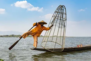 Fishing Net Prints: Fisherman at Inle Lake with traditional Intha conical net, fishing net, leg rowing style