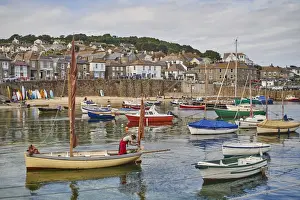 Fisherman Prints: A fisherman makes ready his oyster dredger before setting out from Mousehole Harbour