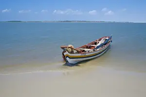 Lencois Maranhenses Prints: Fisherman resting on his boat, Parque Nacional dos Lencois Maranhenses