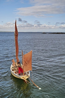 Fisherman Prints: A fisherman sets out in his oyster dredger from Mousehole Harbour, Penwith, Cornwall