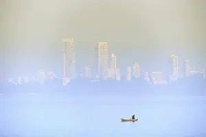 Fisherman Prints: A fisherman in front of the skyscrapers of the Malabar Hills in Mumbai (Bombay)