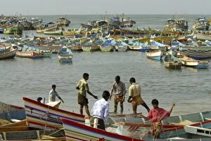 Toiling Collection: Fishermen preparing to go fishing, Vizhinjam, Trivandrum, Kerala, India, Asia