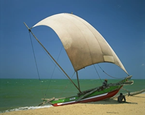 Negombo Prints: Fishermen in the shade of a sail on a fishing boat