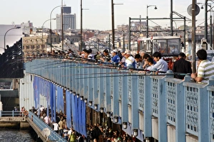 Galata Bridge Prints: Fishermen standing on the Galata bridge, Istanbul, Turkey, Europe