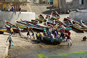 Fishermen Prints: Fishermen taking boat out of water at the port of Ponto do Sol, Ribiera Grande