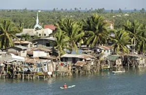 Gulf Prints: Fishermens stilt houses in wetlands at south end of Lingayen Gulf