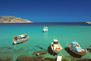 Images Dated 24th September 2009: Fishiing boats and man snorkelling at Anopi Beach, Karpathos, Dodecanese
