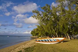 Wooden Boat Prints: Fishing boat on the beach of Anse aux Anglais in the island of Rodrigues