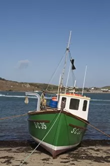 Fishing boat on Bryer with Tresco in background, Isles of Scilly, United Kingdom, Europe