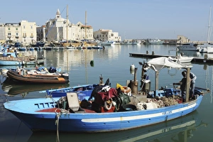 Trani Prints: A fishing boat in the harbour by the cathedral of St. Nicholas the Pilgrim (San Nicola
