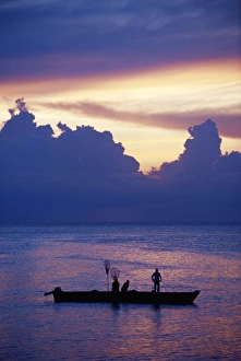 Tanzanian Prints: Fishing boat in the Indian Ocean at dawn, island of Zanzibar, Tanzania