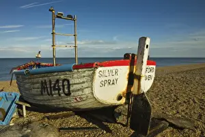Aldeburgh Prints: Fishing boat and nets on the seafront shingle beach of this popular unspoiled seaside town