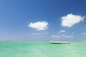 Le Morne Prints: Fishing boat on the turquoise waters, Le Morne, Black River, Mauritius, Indian Ocean