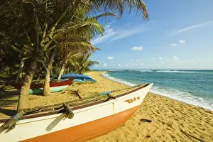 Matara Prints: Fishing boats at the east end of the south coast whale watch surf beach at Mirissa