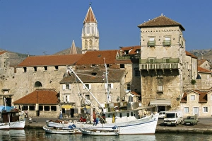 Trogir Prints: Fishing boats in harbour, with houses and tower beyond in the town of Trogir