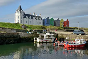 Hotels Prints: Fishing boats in the harbour and the former John O Groats Hotel